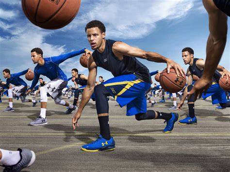 An Under Armour athlete meeting with a social media influencer outdoors to plan marketing.