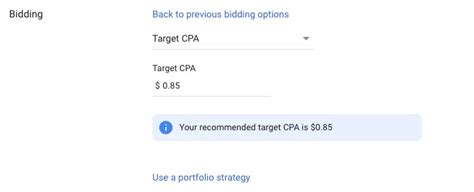 A Google Ads interface displaying Target CPA bidding options shown on a laptop screen