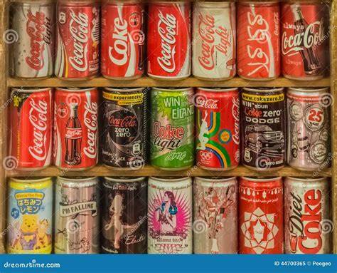 Several Coca-Cola soda cans featuring unique packaging designs from different countries
