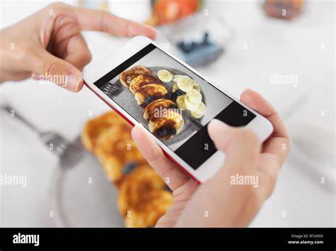 Customers taking pictures of products with smartphones to create user generated content.